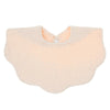 A light peach colored soft cotton baby bib in a bandana style for newborns.
