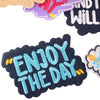 A collection of embroidered iron-on patches featuring colorful text and floral designs on dark fabric.