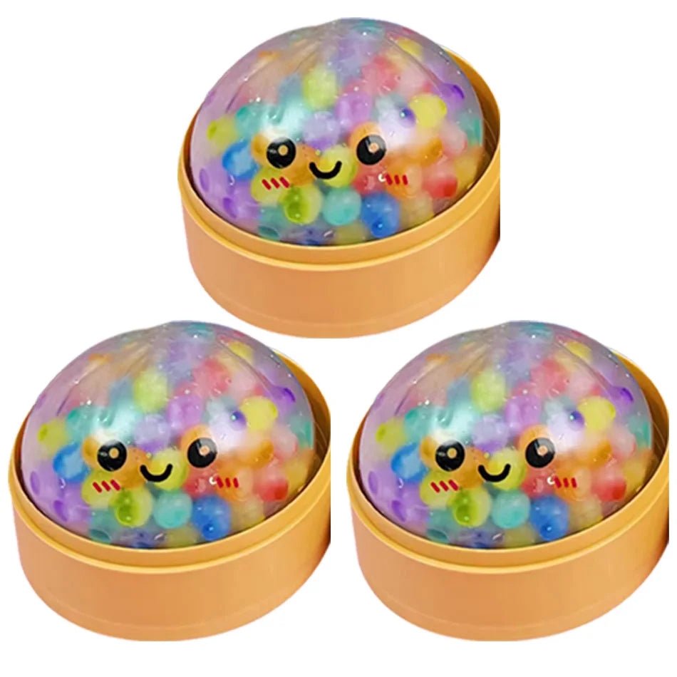 Buntes, durchsichtiges Perlen-Dumpling-Fidget-Spielzeug in einem runden Behälter.