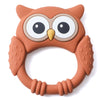 A silicone owl-shaped teether and rattle for babies in a warm brown color.