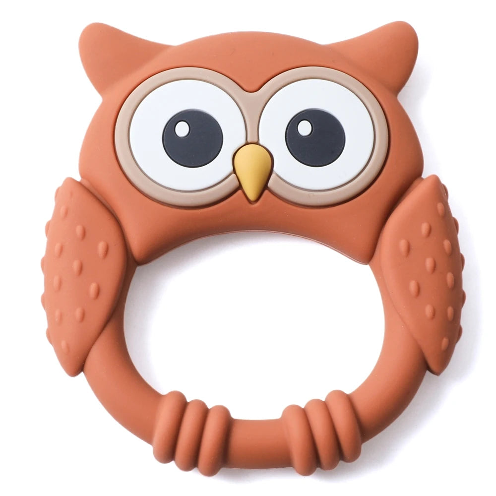 A silicone owl-shaped teether and rattle for babies in a warm brown color.