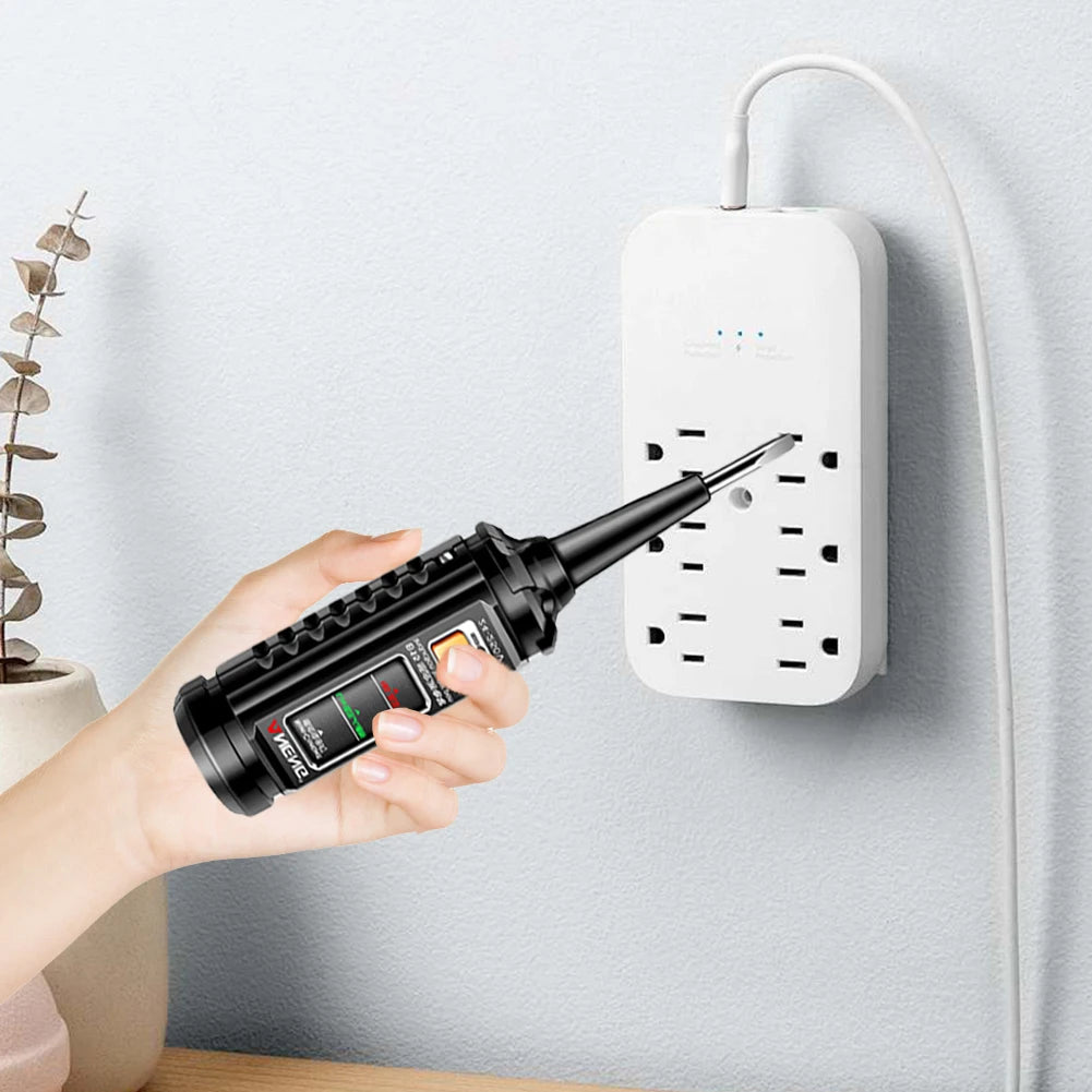 A hand holds an induction test pen with an NCV voltage detector and breakpoint finder against a white wall socket.