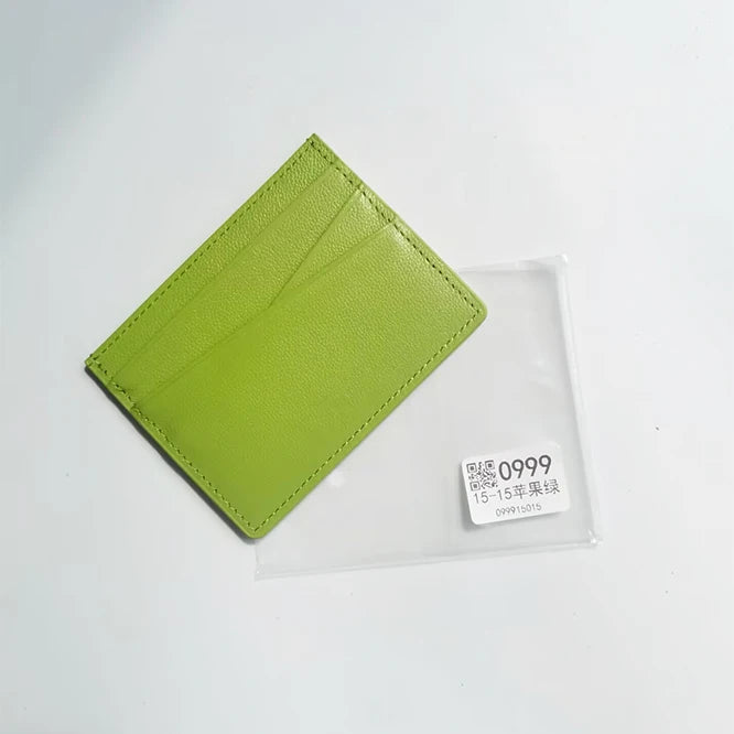 A lime green genuine leather slim card holder wallet placed on a clear plastic background.