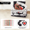 Black and white tissue box with colorful scarves and sound paper for sensory play