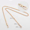 Gold-toned metal purse chain with adjustable buckles shown against a white background.