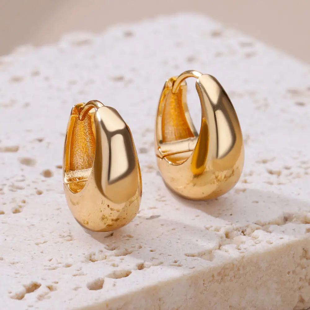 Boucles d'oreilles créoles en zircon cubique ton or