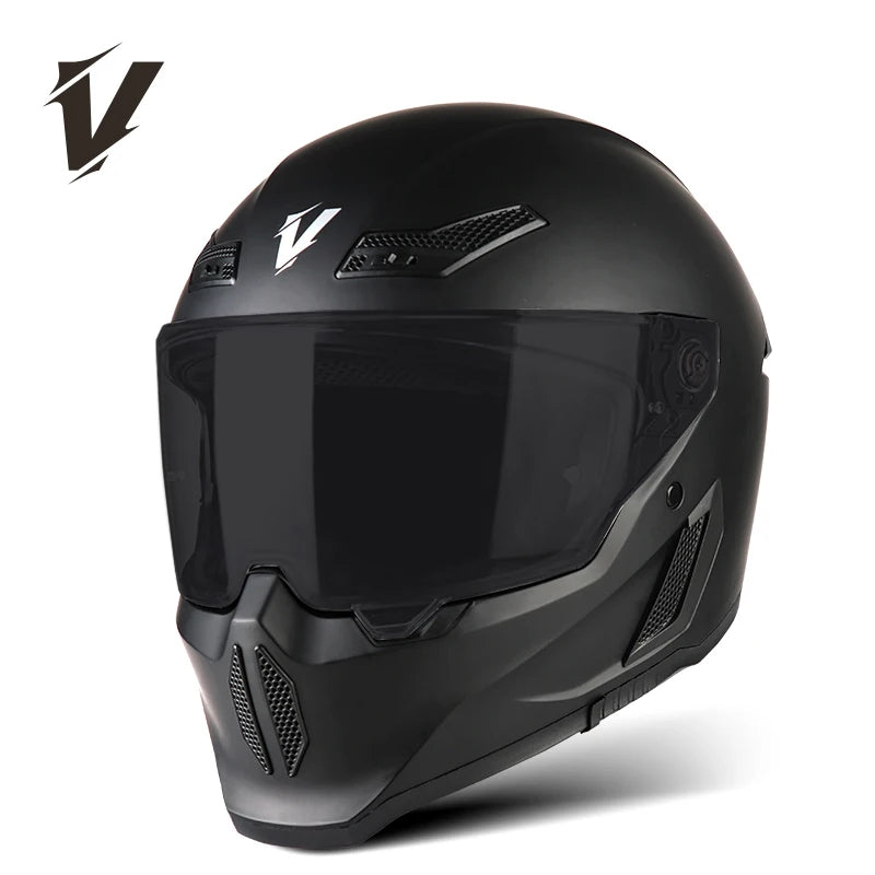 A black full-face motorcycle helmet with a clear visor and ventilation features is shown from the front.