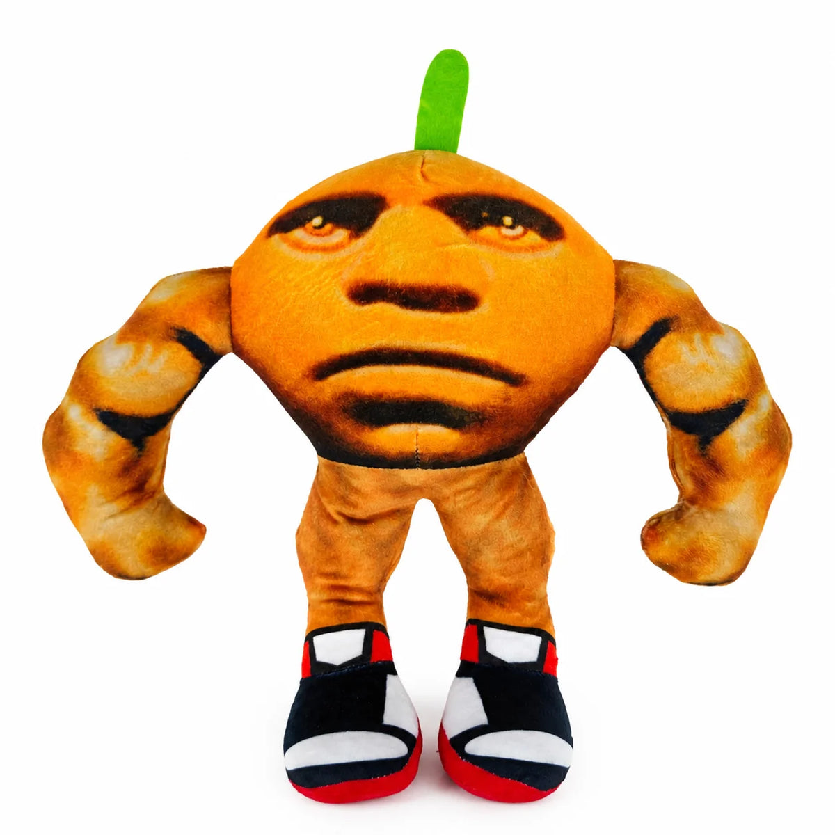 An orange shark plush toy with green fin and black and white shoes.