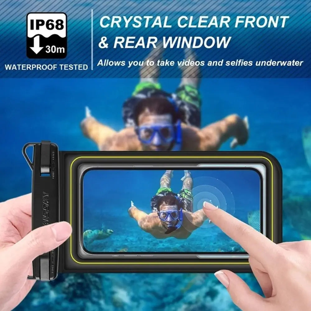 A hand holds a waterproof floating phone case with a clear front and rear window, showing a person underwater.