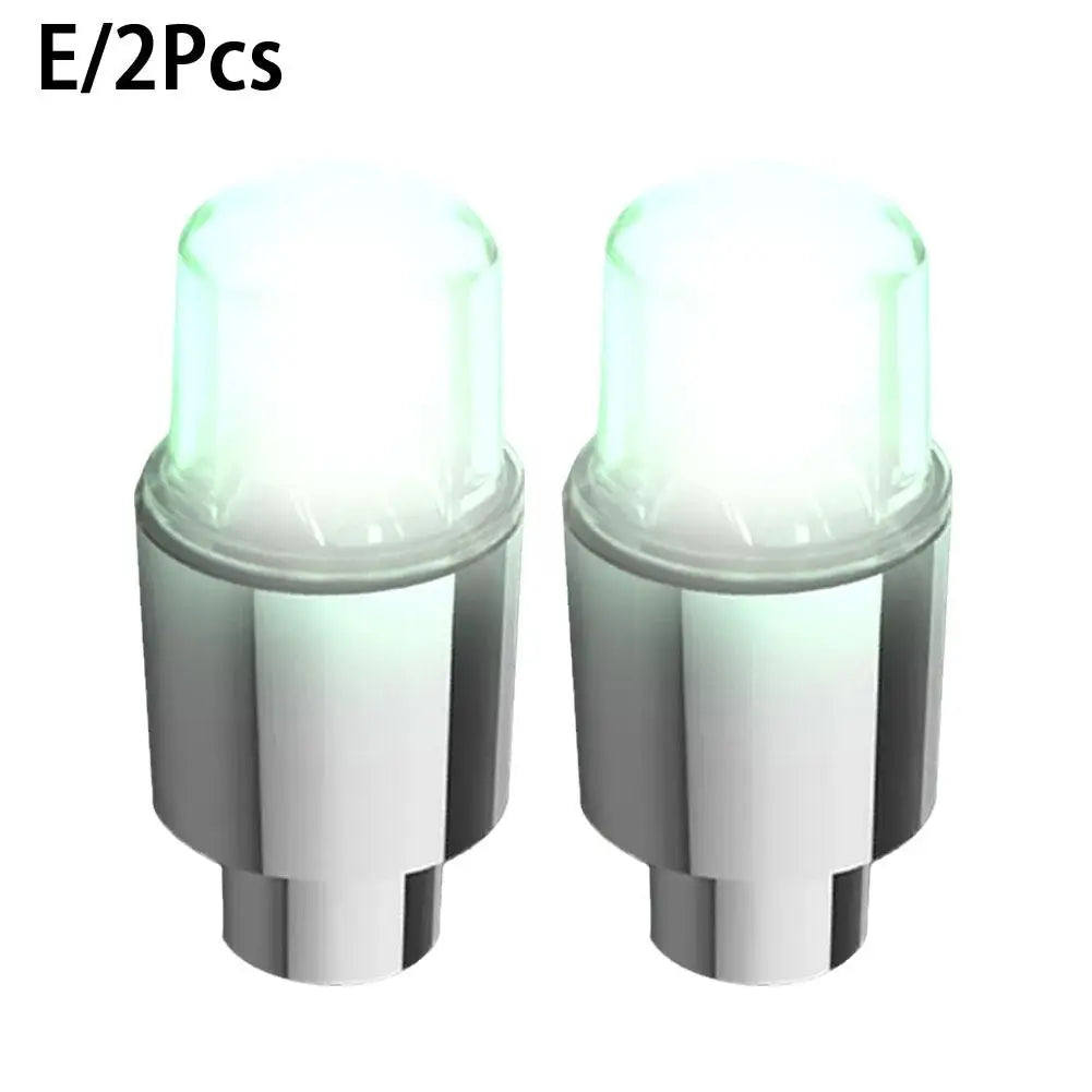 Two motion-activated LED tire valve lights for bikes, cars, and motorcycles.