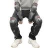 Black impact-resistant motorcycle knee and elbow protective pads worn on a person's legs.