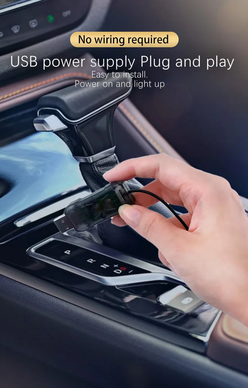 A hand plugs a USB power supply into a car interior component to install an LED light strip.