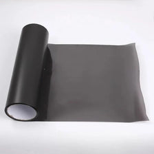 Roll of smoke black headlight and taillight tint film rolled up