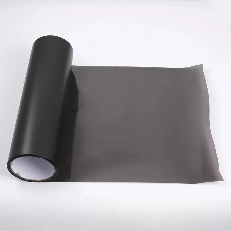 Roll of smoke black headlight and taillight tint film rolled up
