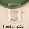 A clear self-sealing jewelry storage bag containing a gold-toned beaded bracelet.