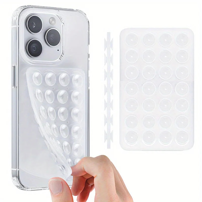 A clear silicone suction cup phone mount is shown next to a smartphone and a silicone suction cup holder.