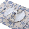 A beige gingham table runner with a white plate and silverware displayed on it.