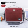 A maroon insulated lunch bag with a gray shoulder strap is shown on a white surface.