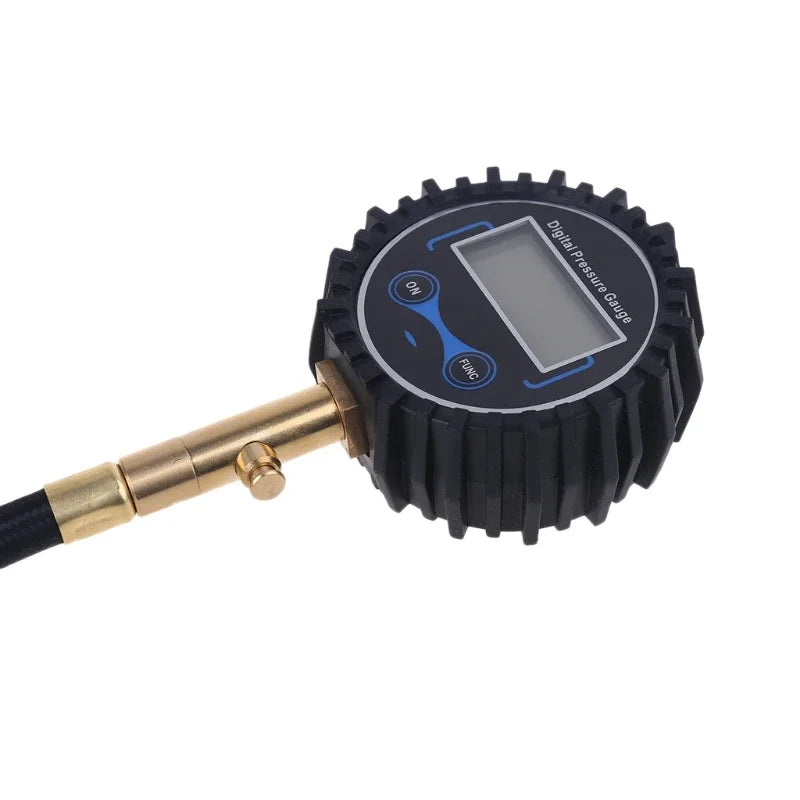 A black digital tire pressure gauge with a quick-connect air chuck attached.