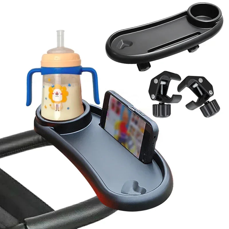 A black stroller snack tray with a cup holder and phone slot is shown mounted on a stroller seat.