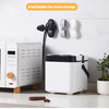 A white cord organizer and wire winder device is mounted on a wall next to a white appliance.