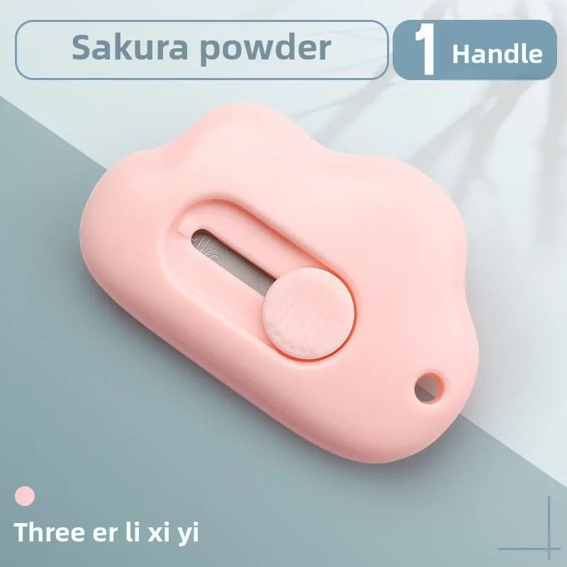 A pink cloud-shaped retractable letter opener with a handle and keychain loop.