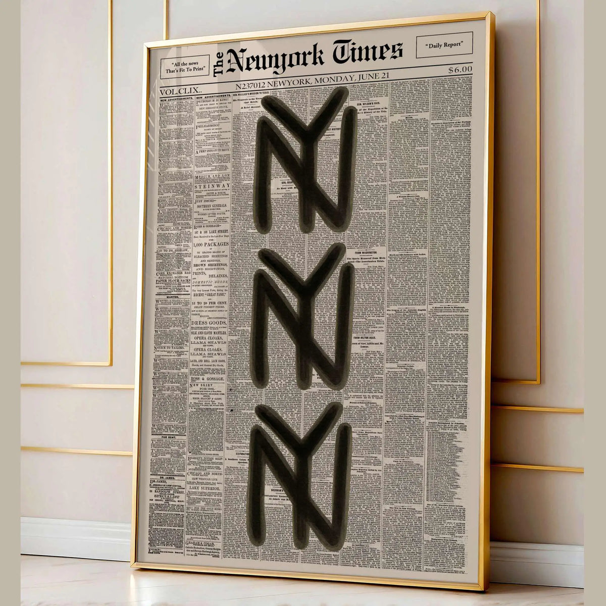 Framed vintage newspaper style wall art featuring the stylized NYT logo on a light background.