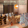 A vanity area setup showing a flexible elastic cord drying station with various clothing items.