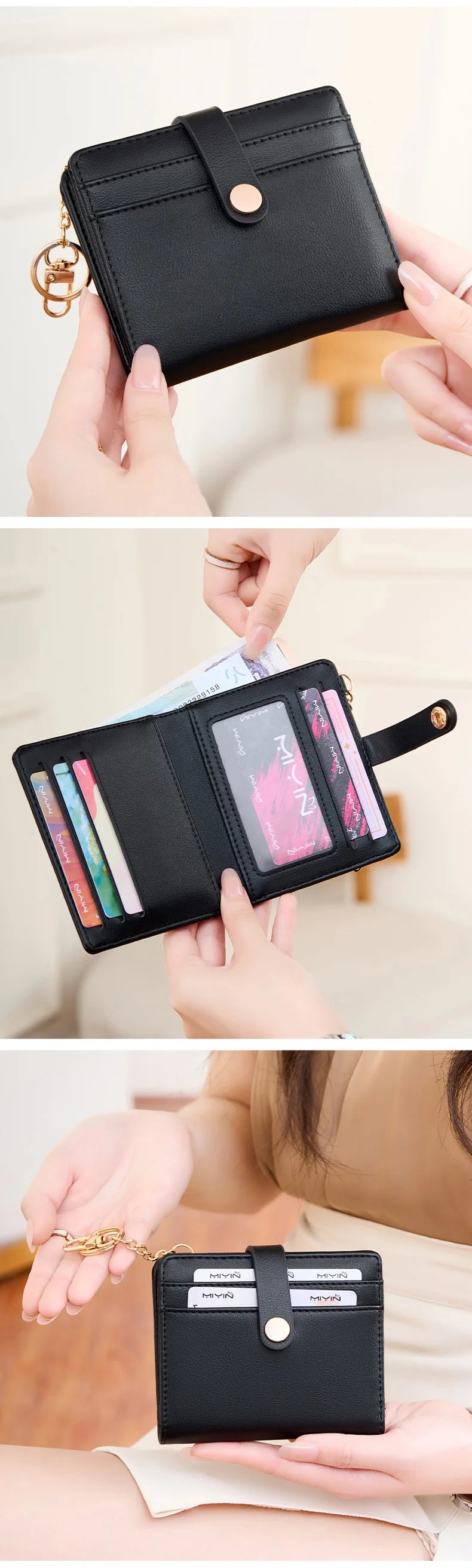 A black bi-fold credit card wallet with a gold chain detail is shown being held by hands.