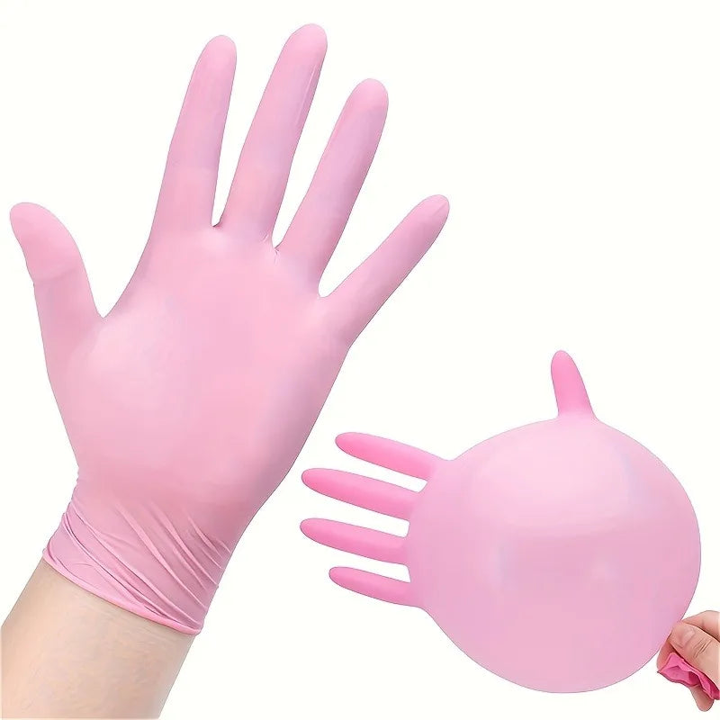 A pair of pink disposable nitrile gloves shown with a hand and a separate glove model.