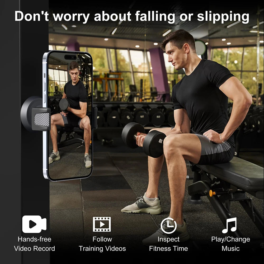 A man is using a magnetic phone holder to record fitness videos in a gym setting.