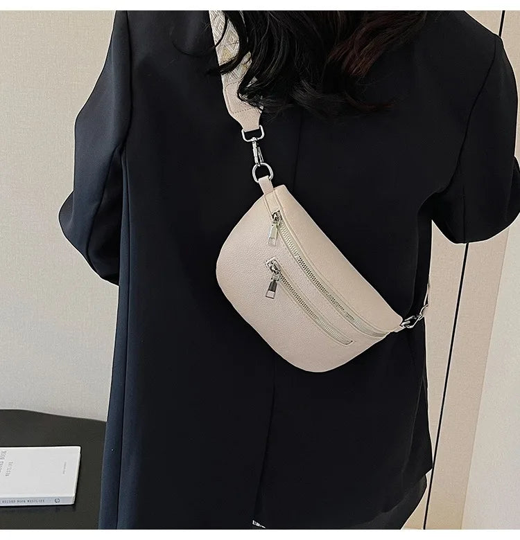 A beige multi-pocket PU leather waist bag with a silver chain strap is shown against a black garment.