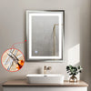 A bathroom vanity featuring a white vessel sink and a framed mirror with integrated LED lighting.