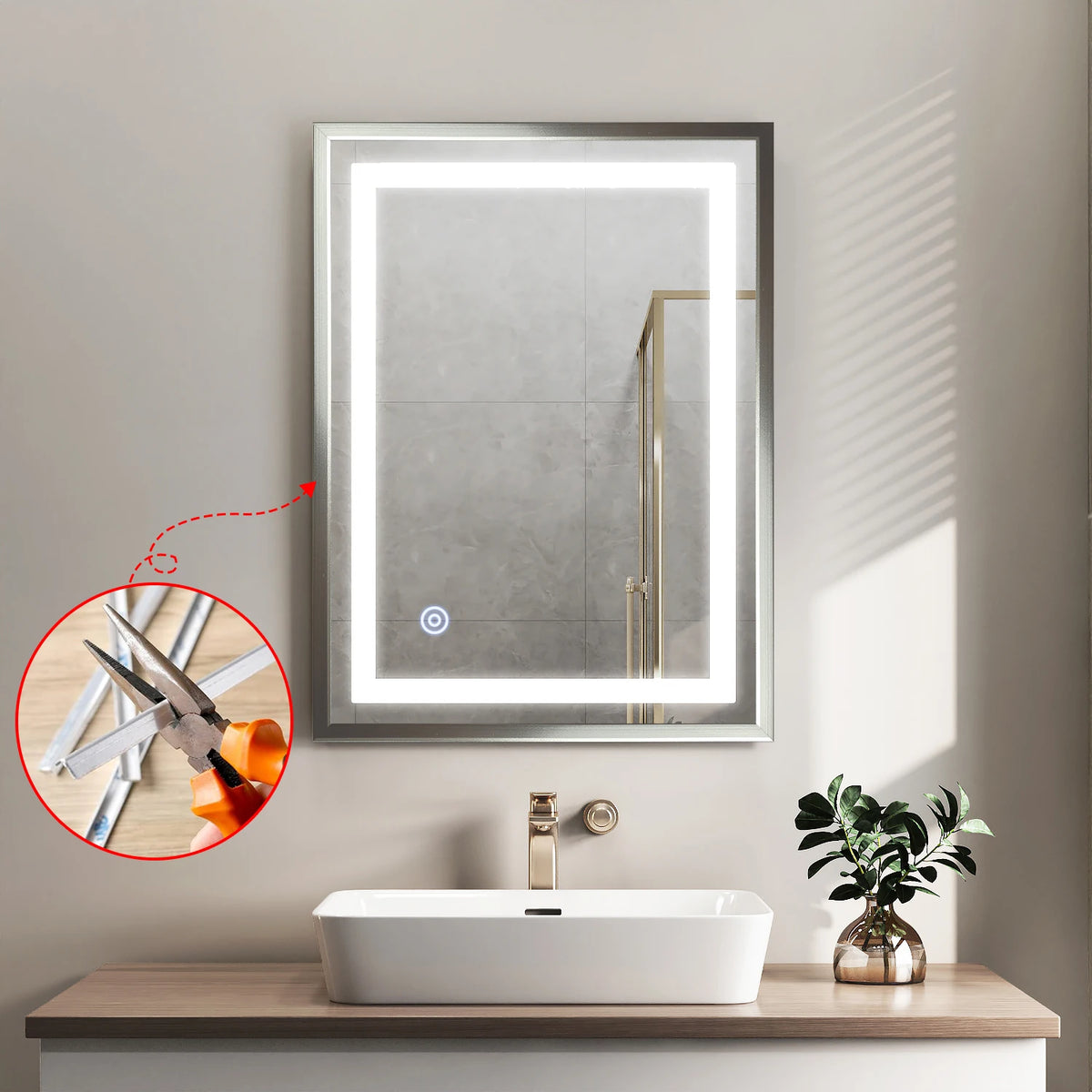 A bathroom vanity featuring a white vessel sink and a framed mirror with integrated LED lighting.