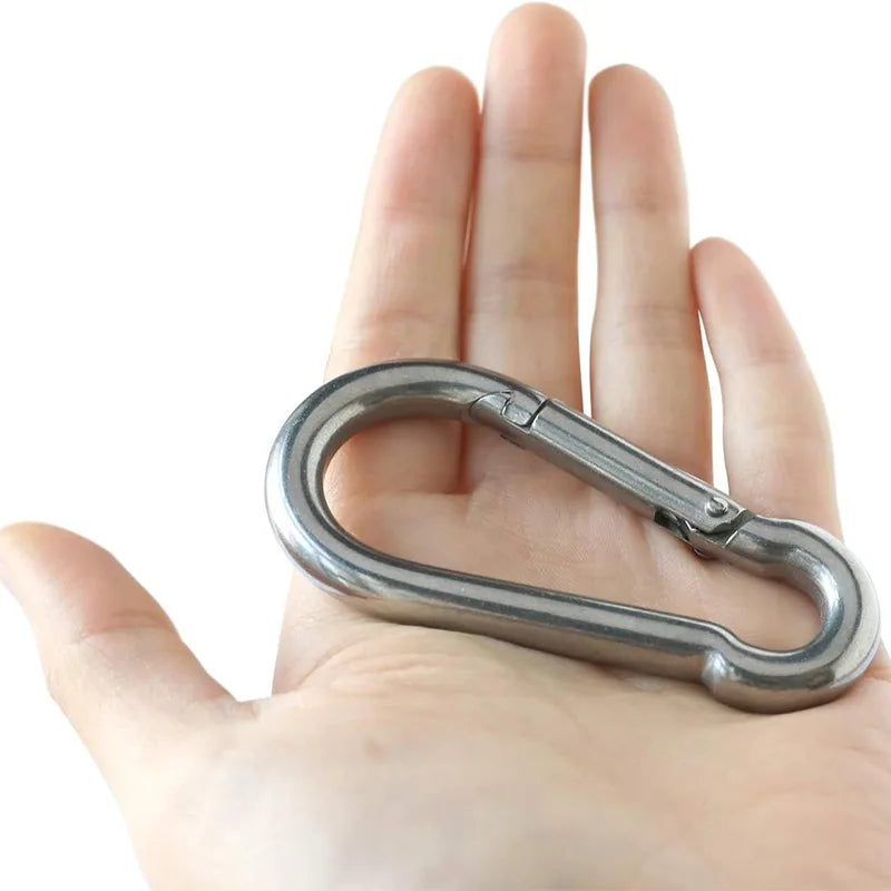 A hand holds a heavy-duty stainless steel ceiling mount hanging kit.