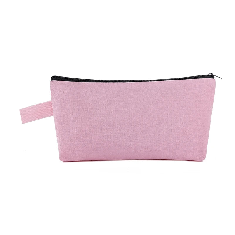 A pink canvas zipper pouch for cosmetics, stationery, and travel.