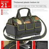 Black tool kit bag with a thick plastic bottom and camouflage fabric, shown from above.