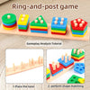 A set of ring-and-post game blocks in various colors stacked on a wooden board for shape matching.