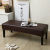 A dark brown waterproof PU stretch bench cover is placed on a light wooden floor.