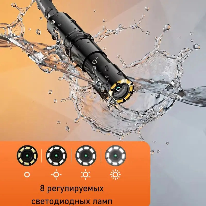 Industrial endoscope probe being used to inspect a pipe, showing water splashing around the tip.