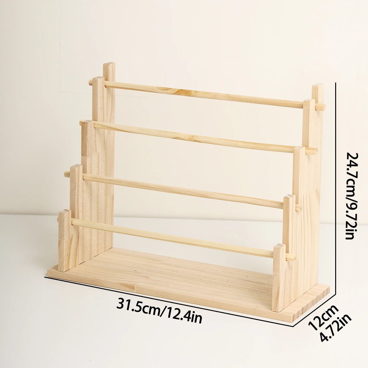 A solid wood ladder jewelry organizer featuring multiple storage tiers and a slanted display rack.
