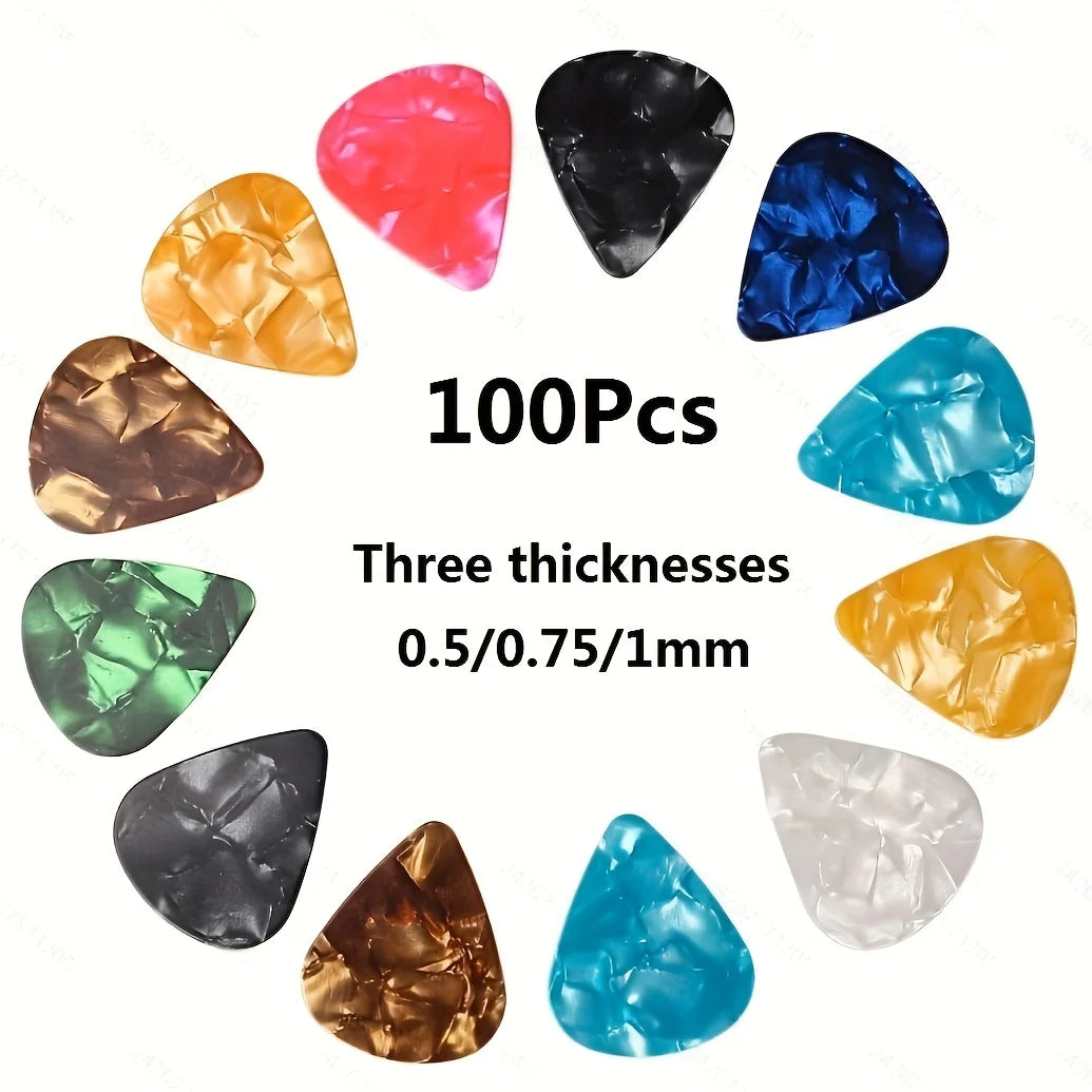 A collection of 100 assorted guitar picks in various colors and three thicknesses, including red, black, blue, green, gold, a