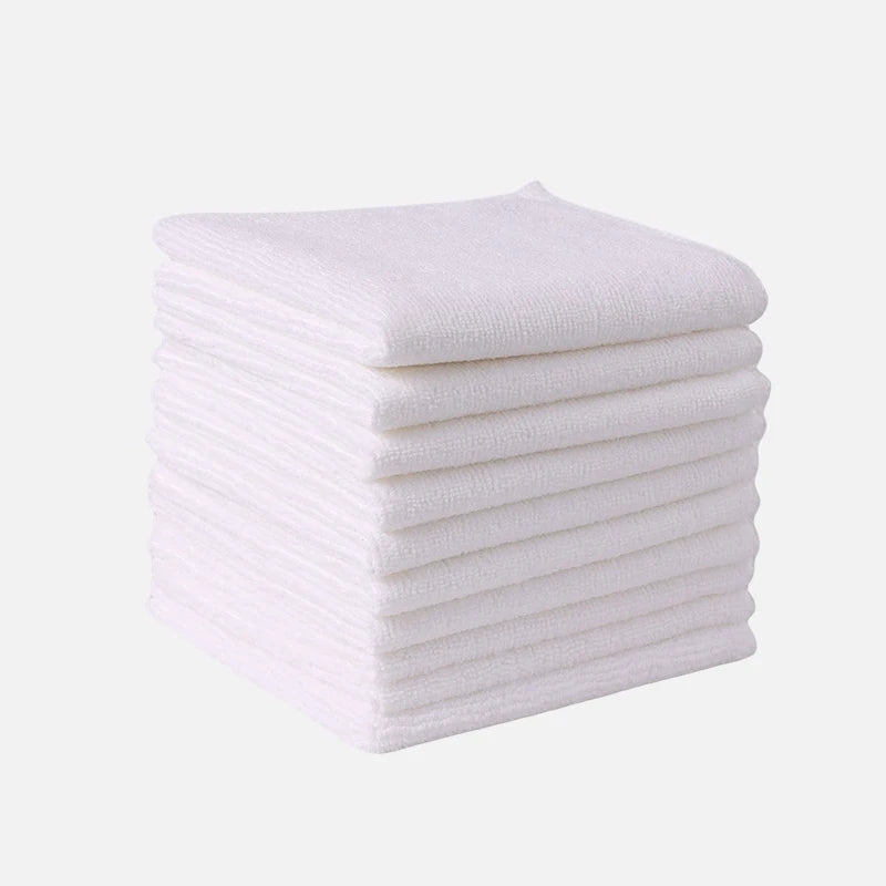 A stack of white thickened microfiber cleaning towels.
