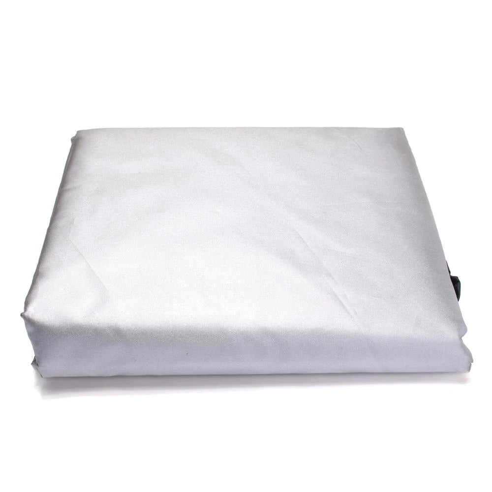 A white weatherproof patio furniture cover rolled up for storage.