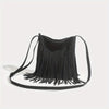 A black bohemian fringe shoulder bag with thin straps is displayed against a white background.