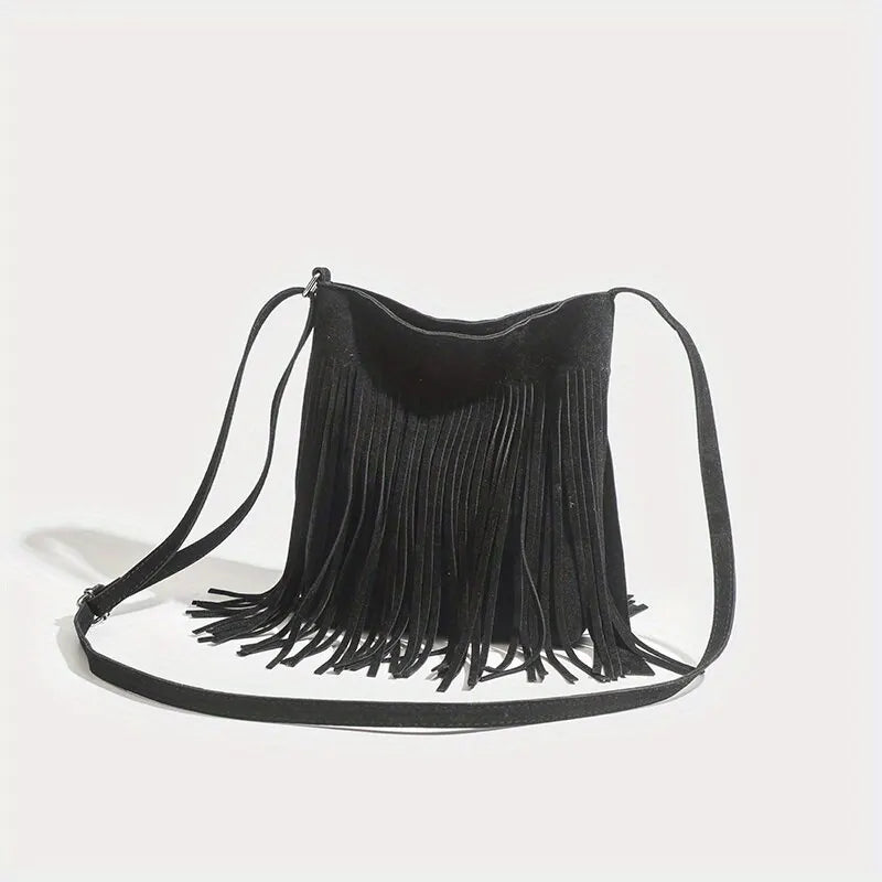 A black bohemian fringe shoulder bag with thin straps is displayed against a white background.