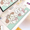 Kawaii cartoon cat desk mat featuring cute white cats on a light green background with a non-slip rubber base