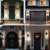 Exterior view of a modern house featuring dark green doors and light gray siding with vertical LED wall sconces.