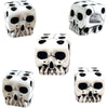 A set of white skull dice used for tabletop games and Halloween
