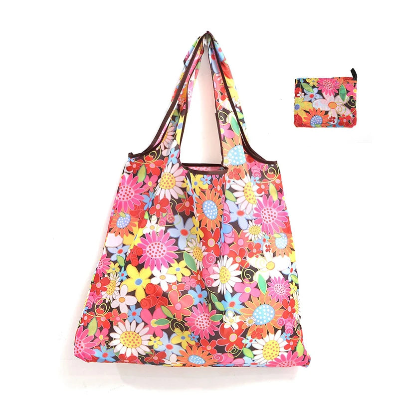 A colorful floral print reusable shopping tote bag with a matching small carry pouch.